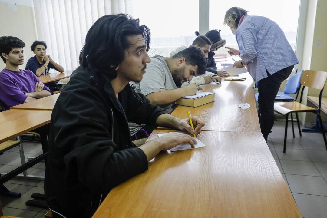 Migrantai Kybartų užsieniečių registracijos centre