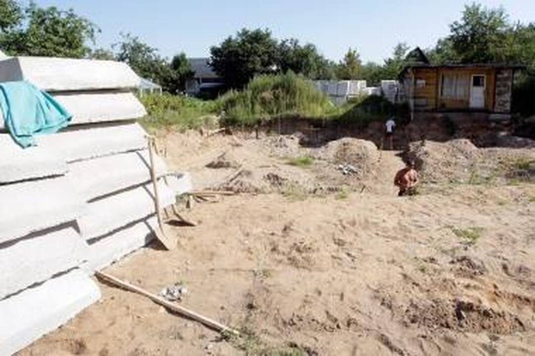 Sodai virsta gyvenamųjų namų kvartalais
