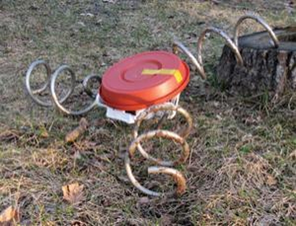 Robotas kamščiatraukio kojomis