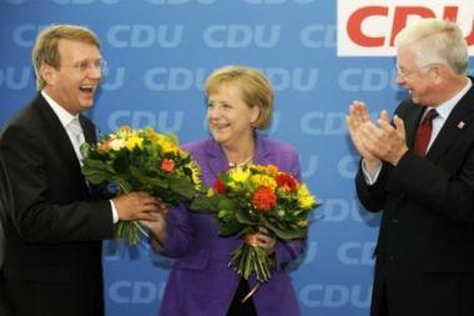 Triumfas: A.Merkel populiarumo nesugadino net šaliai skaudžiai smogusi krizė.